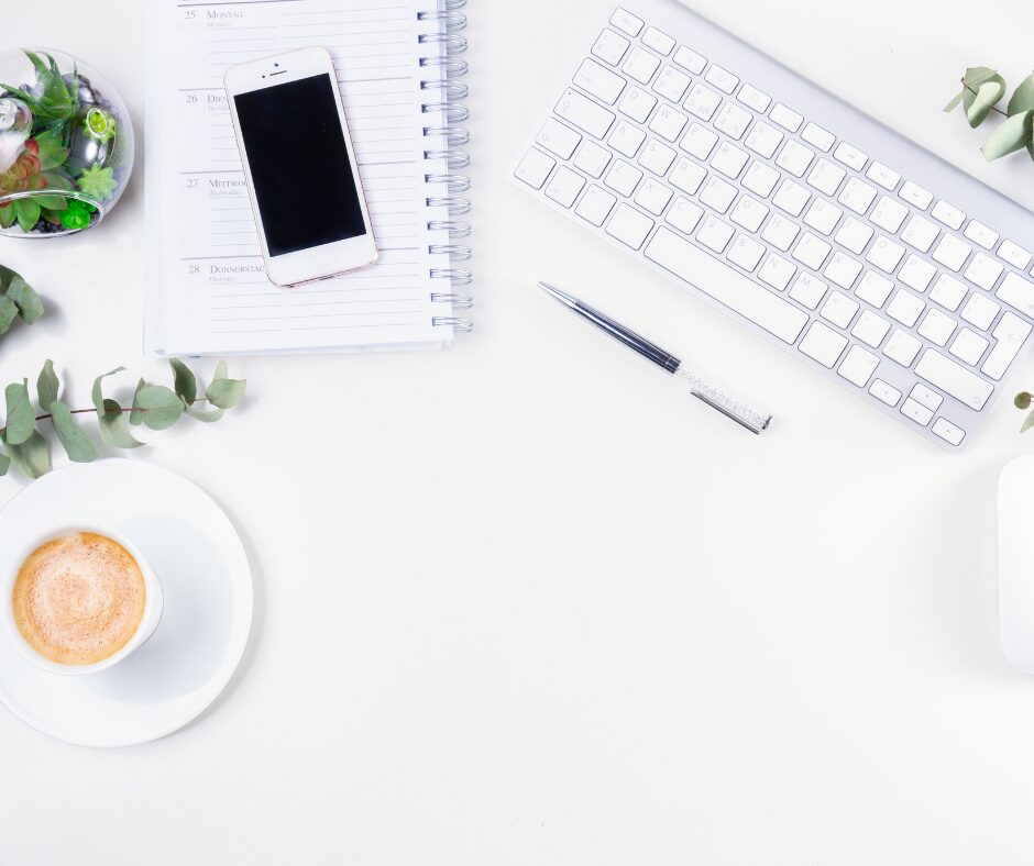 Coffee, cell phone, and laptop. Ready to type.